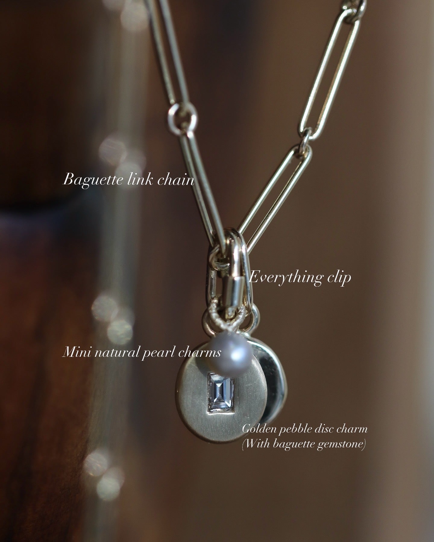 Gold pebble disc charm with baguette sapphire & diamonds